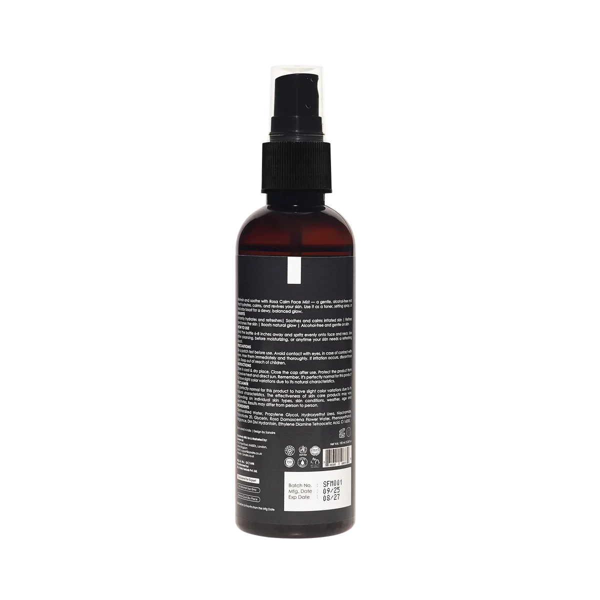 Back of amber skincare spray bottle with black pump and ingredient label visible