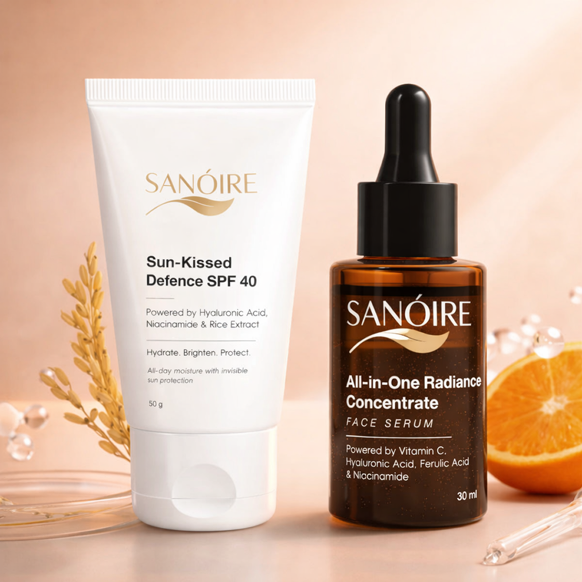 Two Sanoire skincare products—SPF 40 sunscreen and radiance serum—displayed with orange and rice, highlighting sun protection and brightening ingredients.