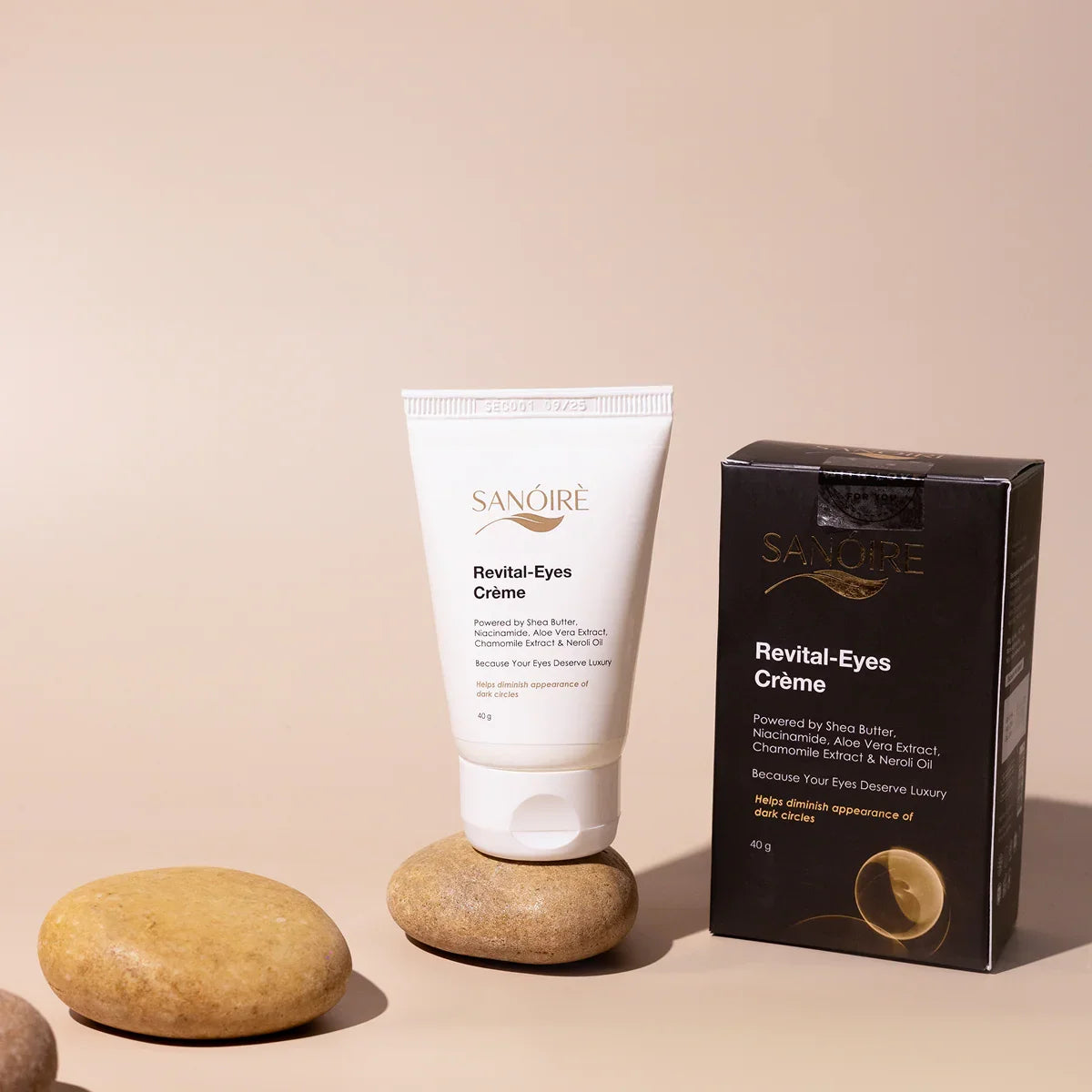 Revital-Eyes Crème tube and box on smooth stones, barrier repair eye cream skincare