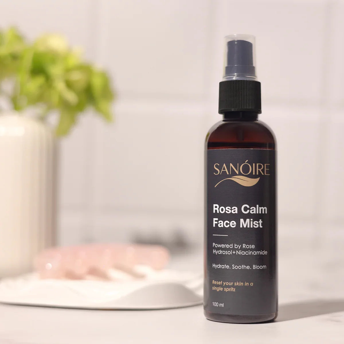 Rosa Calm Face Mist spray bottle on bathroom counter, skincare hydrating product