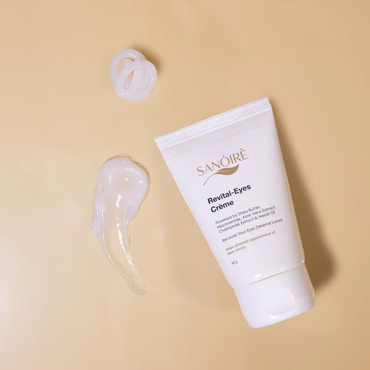 Revital-Eyes eye cream tube with creamy texture on beige background, skincare product
