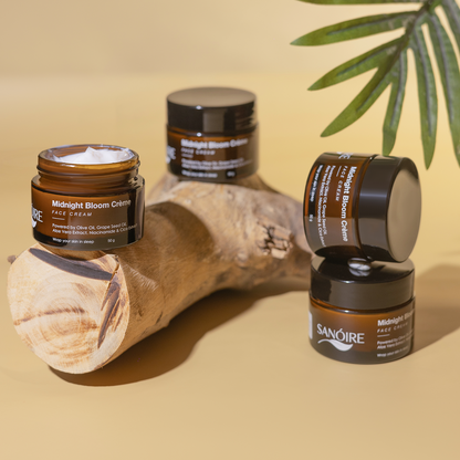 Midnight Bloom Crème face cream jars on wood with plant, skincare product display